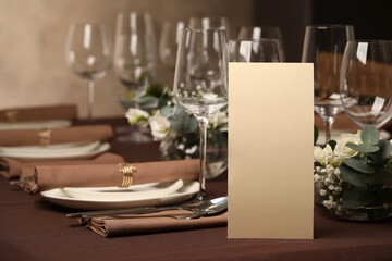 Stylish elegant table setting for festive dinner in restaurant