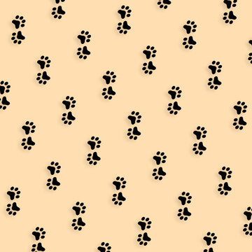 Colorful pattern of cat paws on orange background. Seamless pattern with cat paw. Dog, cat footprint background