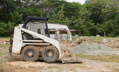 Mini excavator at the construction site.