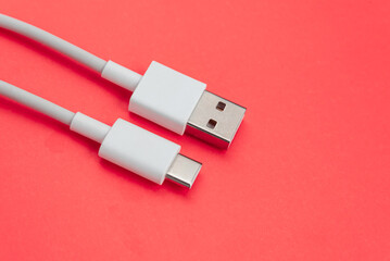USB cable type C over orange background