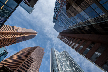 Looking up at skyscrapers in the city of Calgary.
