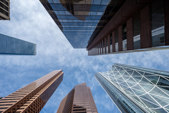 Looking up at skyscrapers in the city of Calgary.
