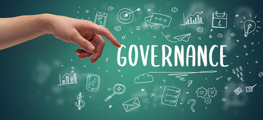 Close-Up of cropped hand pointing at business inscription