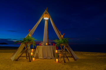 beach at night for romantic dinner setup