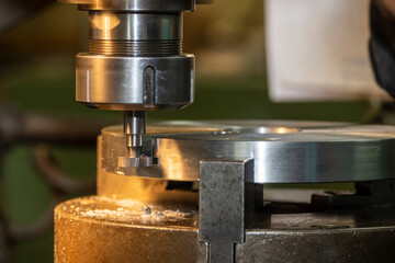 The NC milling machine T-slot cutting the metal parts.