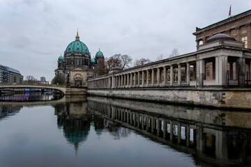 Fototapeta premium View of the Berliner Dom (Berlin Cathedral), a monumental German Evangelical church and dynastic tomb (House of Hohenzollern) on the Museum Island in central Berlin from the bank of the River Spree