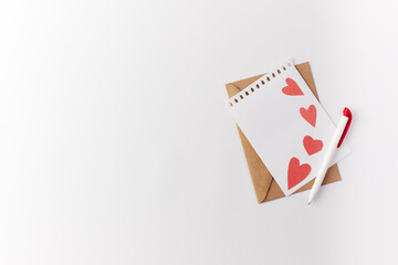 Valentine's Day, a note in a paper heart envelope. Top view. Copy space. Place for text.