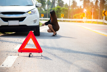 Business woman calling car insurance for assistance broken car on the road, signs Emergency .