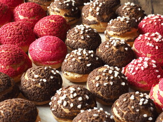 Choux cream with red and brown cracked sugar crust