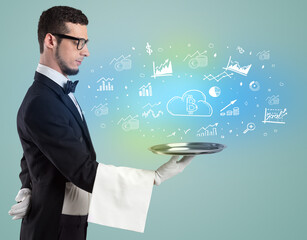 Handsome young waiter in tuxedo holding money icons on tray