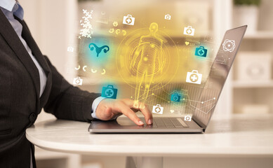 Doctor working on laptop with healthcare concept