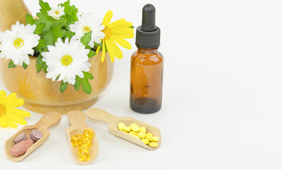 Natural alternative medicine with capsules essence and plants