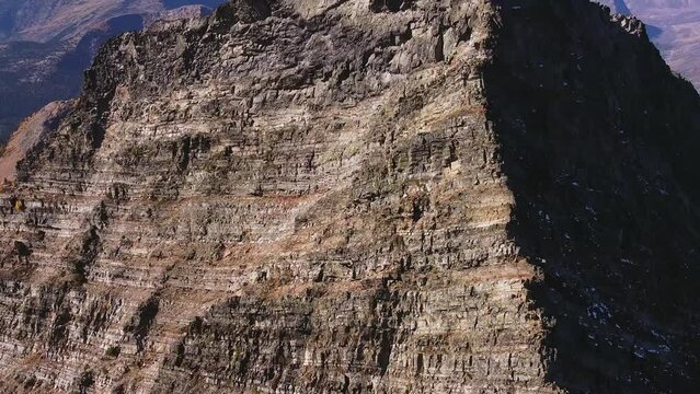 A person standing on the top of the very steep  mountain, pedestal shot, Purcell mountains