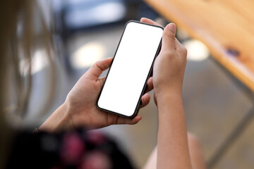 A smartphone blank screen mockup in women's hands template