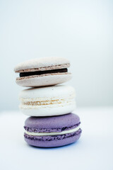 purple gray and white macarons on a white background fresh and delicious dessert