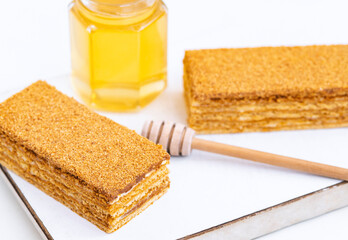 Honey layered cake or russian cake Medovik on white background. Close up view