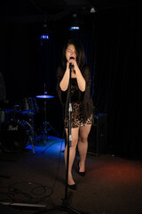 Obraz na płótnie Canvas Chinese Singer in a hidden club during lockdown downtown Toronto