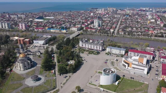 Aerial view of Poti Cathedral, river Rioni and city center on spring sunny day, Georgia