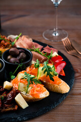 bruschetta with salmon close-up, Italian tosted bread with salmon and cheese