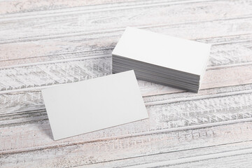 Business cards blank. Mockup on gray wooden background. Copy space for text.