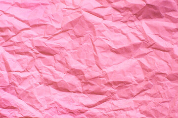 しわのついたピンク色の紙