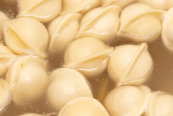 Dumplings made from dough and meat are boiled in boiled water.