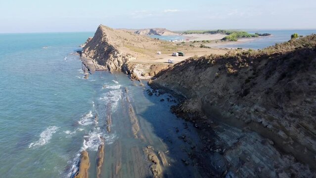 Porto Novo Beach, Zvernec, Vlore, Albania - Aerial Drone View of the Rocky Coastline with Motorhomes, Campers and Vans