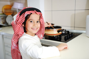Little kid boy is cooking , high quality photos