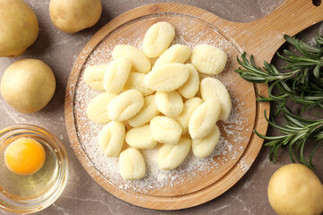 Concept of cooking with raw potato gnocchi, top view