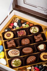 chocolate and colorful candies in a box