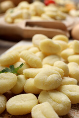 Concept of cooking with raw potato gnocchi, close up