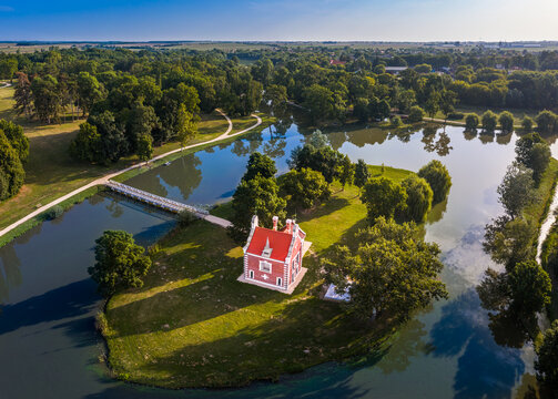 Deg, Hungary - Aerial view about the beautiful Holland house (Hollandi haz) on a small island at the village of Deg on a summer sunrise with clear blue sky and green summer foliage