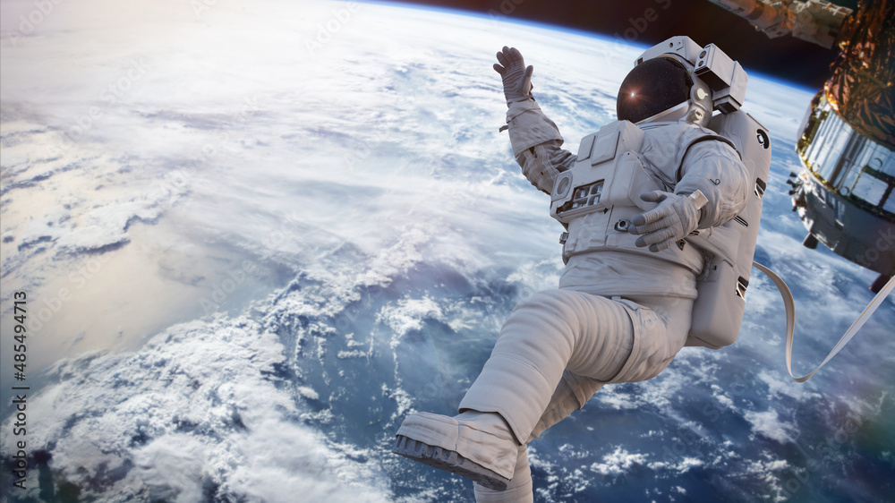 Wall mural astronaut during spacewalk in Earth orbit