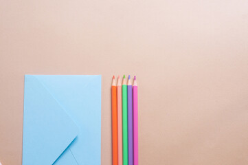 Colorful pencils on light yellow backgroundcreativity concept copy spaccee flat lay