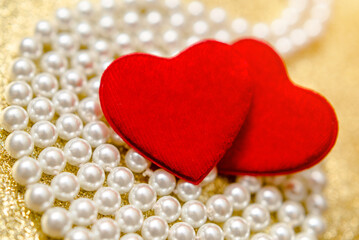 Heart symbol on a gold shiny background