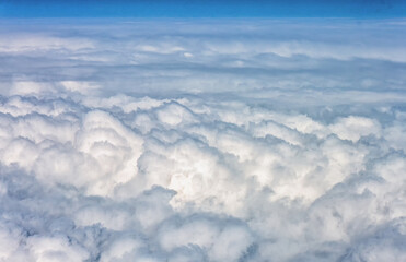 Fototapeta na wymiar View through the window of an airplane inside the clouds