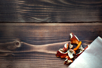 Dried pieces of mushroom fly agaric on table from package. Natural microdose, microgram of...