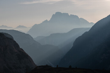 A beautiful shot of Dolomite Mountains with sunrays in Italy