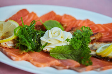 The food in the restaurant fish dish cutting of different types of fish and seafood on a platter
