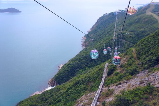 Ngong Ping 360 is a cable car in Hong Kong on Lantau Island. Ngong Ping 360 connects Tong Chung on the north coast of Lantau Island with Ngong Ping on the hills in the center of the island. 