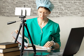 doctor in medical form conducts online training and consultation by phone, online medical...