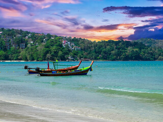 Fototapeta na wymiar Colourful Sunset Patong Beach lovely vibrant orange, pink and Blue colours Phuket Thailand Thai