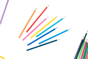 Wooden colored pencils isolated on a white background.