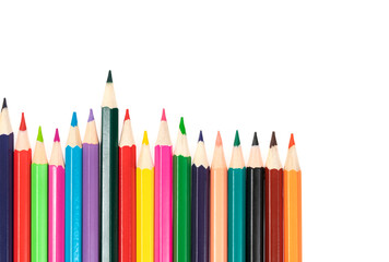 Wooden colored pencils isolated on a white background. A line of multicolored pencils in a large plan