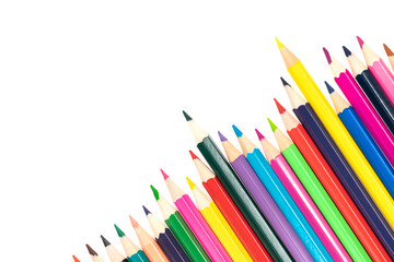 Wooden colored pencils isolated on a white background. A line of multicolored pencils in a large plan