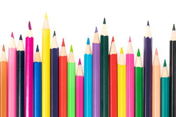 Wooden colored pencils isolated on a white background. A line of multicolored pencils in a large plan