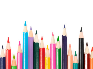 Wooden colored pencils isolated on a white background. A line of multicolored pencils in a large plan