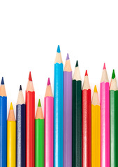 Wooden colored pencils isolated on a white background. A line of multicolored pencils in a large plan