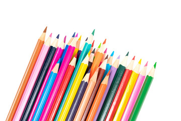 Wooden colored pencils isolated on a white background. A line of multicolored pencils in a large plan