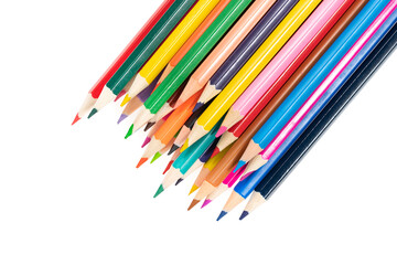 Wooden colored pencils isolated on a white background. A line of multicolored pencils in a large plan